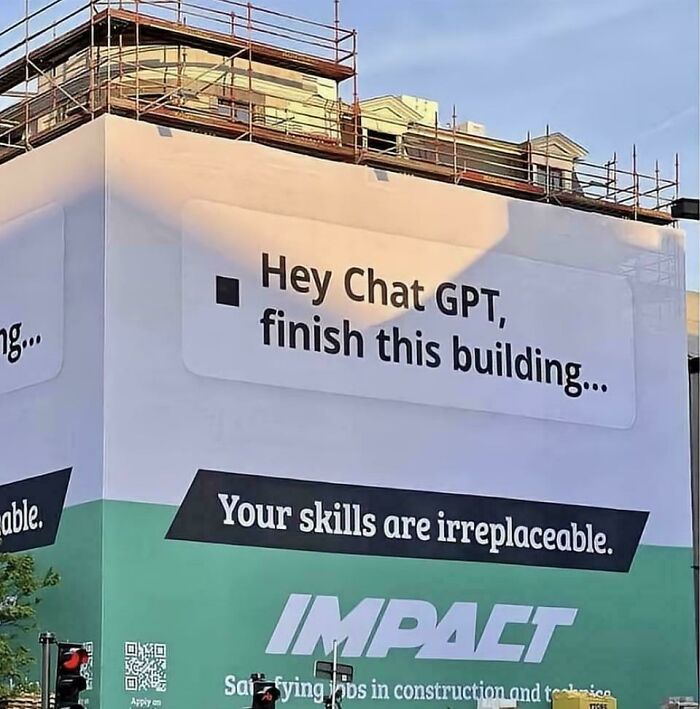 Building wrapped with message asking Chat GPT to finish construction