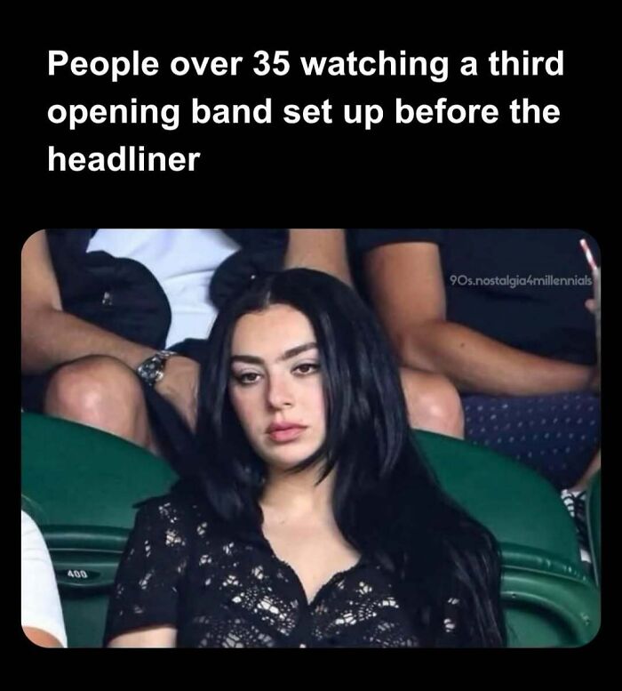 Meme featuring a bored woman in stadium seating, capturing nostalgic 90s concert energy.