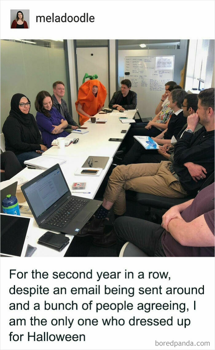 A person dressed in a pumpkin costume at a serious office meeting, sharing funny Tumblr posts.