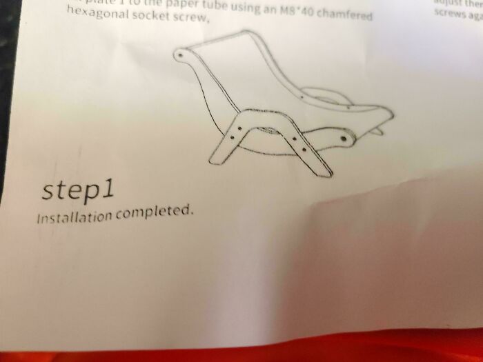 Furniture assembly instructions showing completed installation of a chair
