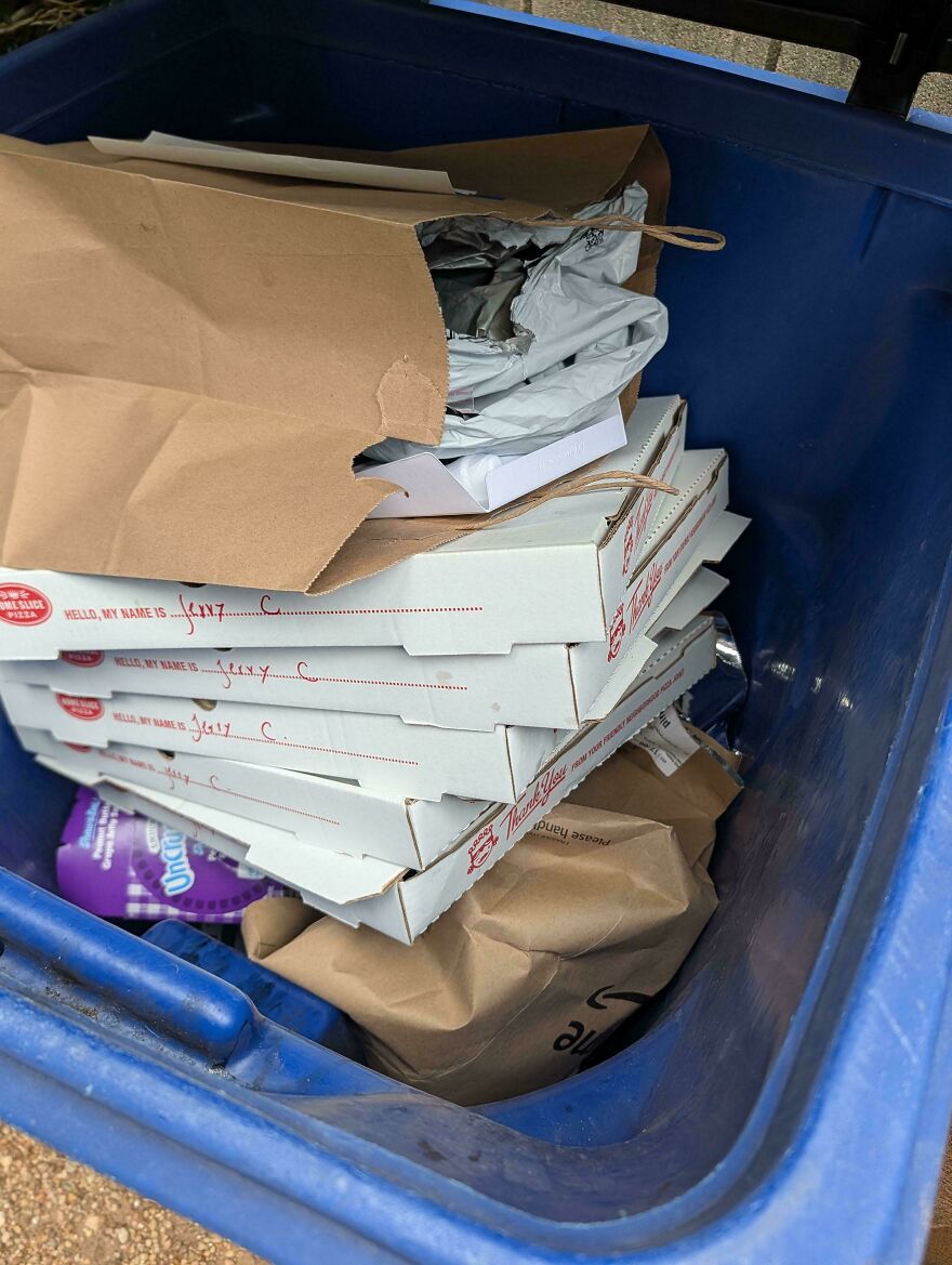 Overflowing trash bin full of pizza boxes highlights Airbnb cleanliness fail