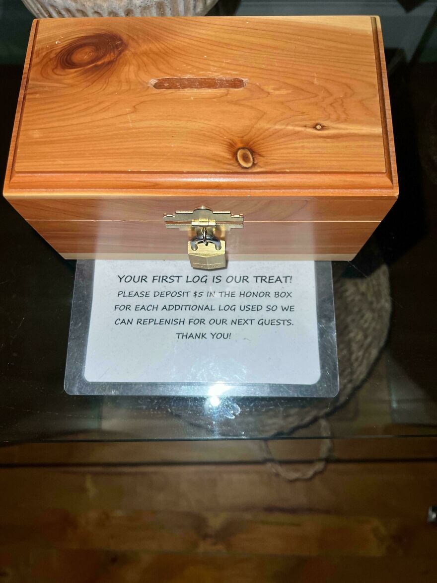 Wooden honor box for logs with a sign asking for $5 deposit revealing hotel and Airbnb fails