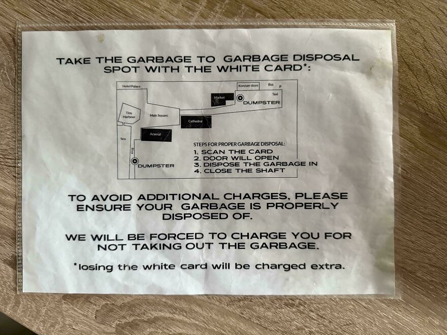 Garbage disposal instruction sign with map and warnings at Airbnb rental