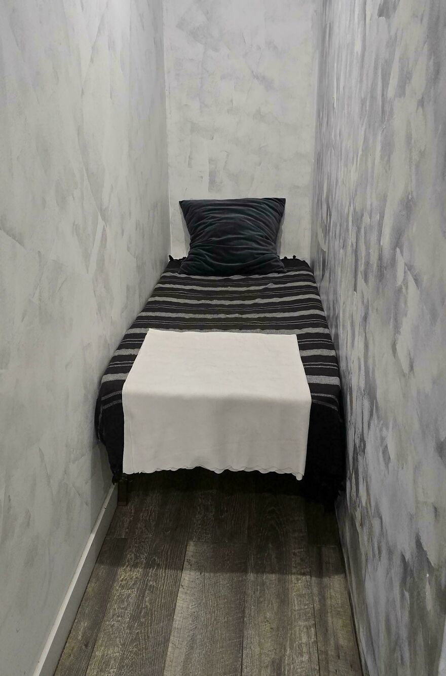 Extremely narrow single bed in cramped Airbnb room