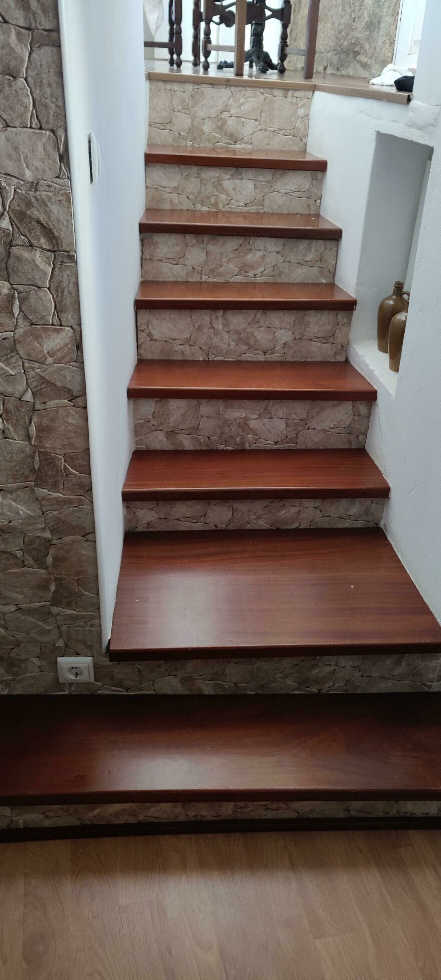 Stairs with stone patterned risers and wooden steps in rental Airbnb fail