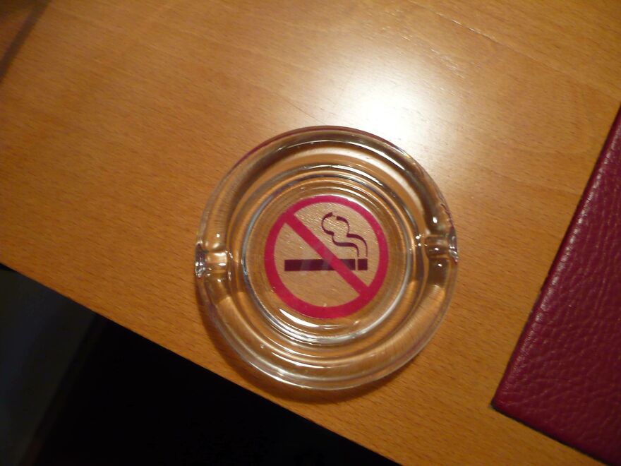 No smoking sign in ashtray on hotel room desk fail