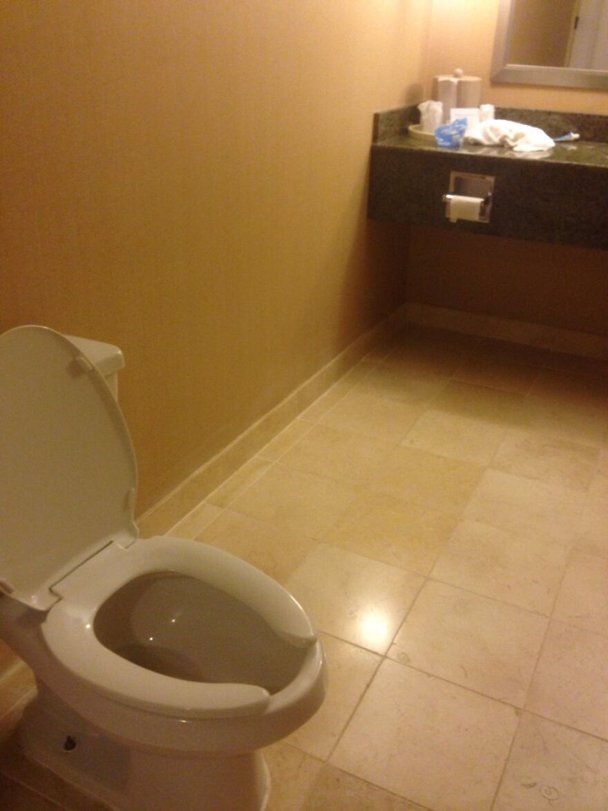 Toilet paper installed far from toilet in poorly designed hotel bathroom