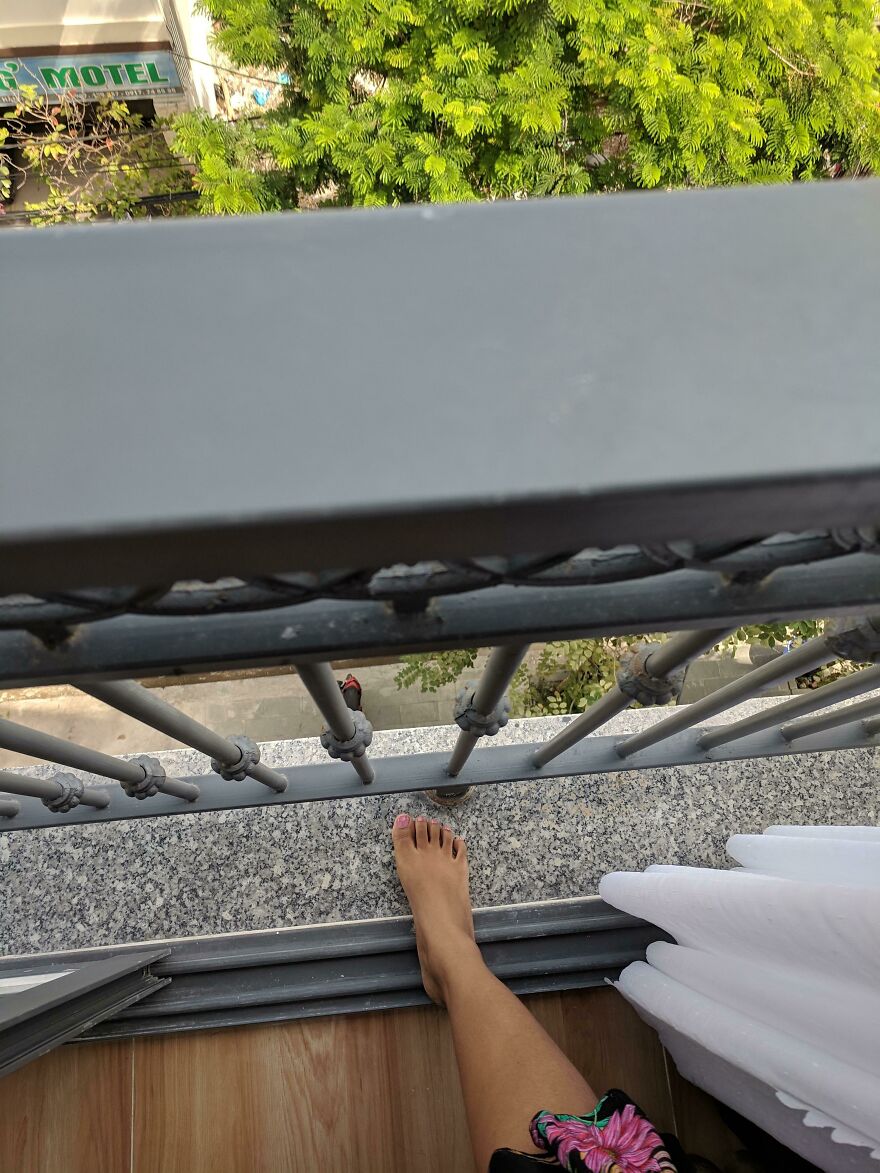 Risky hotel balcony with narrow ledge and uncovered drop