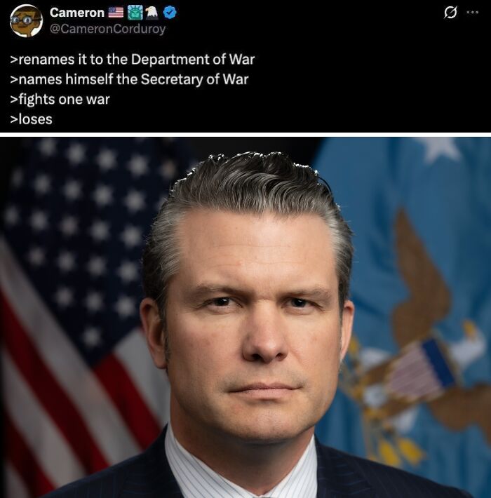 Man in suit with American flag background, dystopian war department meme text above
