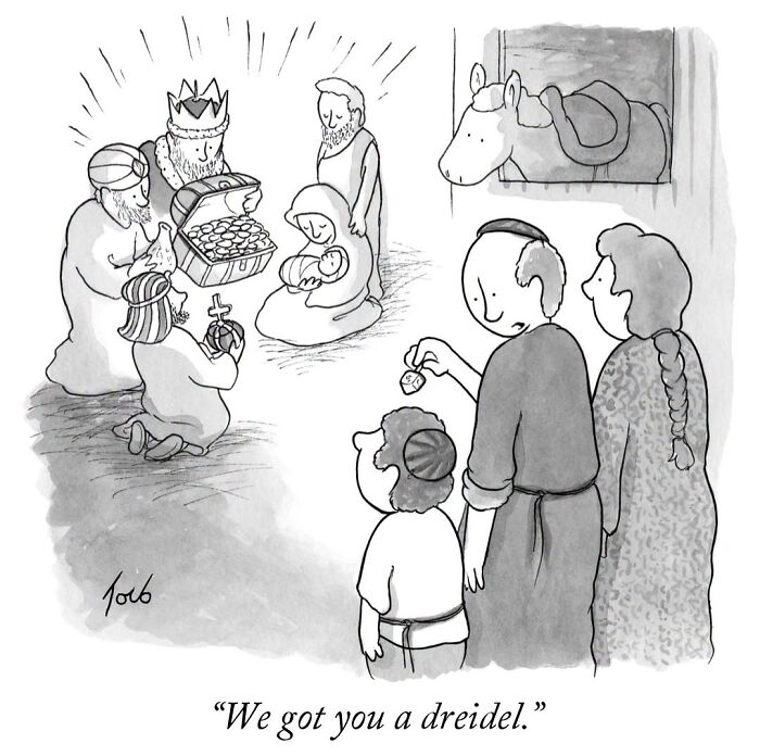 One-panel comic showing a family giving a dreidel to a child at a Nativity scene