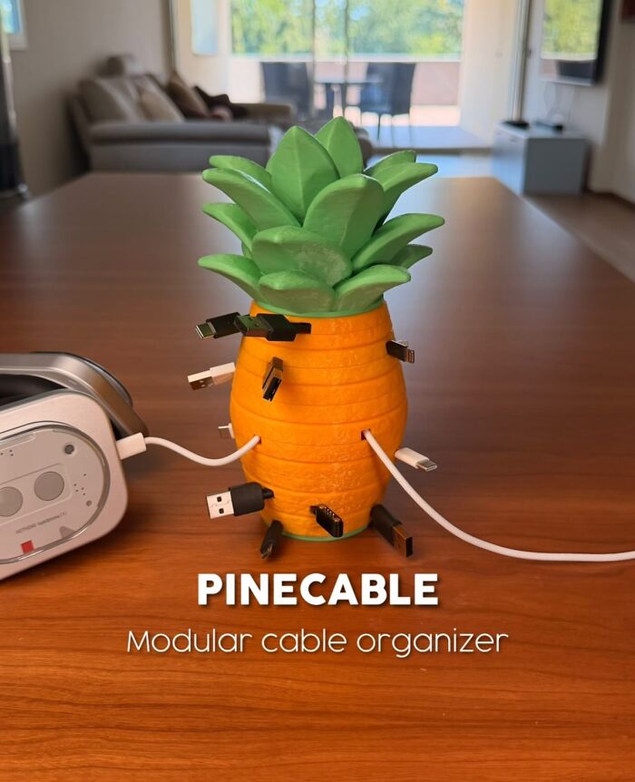 3D printed pineapple shaped modular cable organizer holding multiple charging cables
