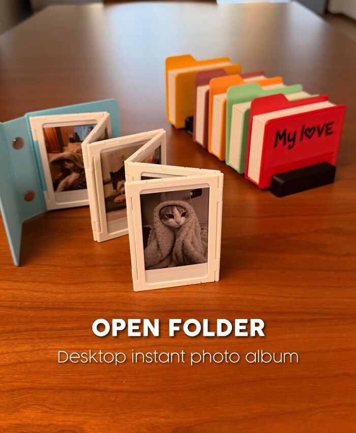 3D printed desktop instant photo album with colorful folders and cat pictures