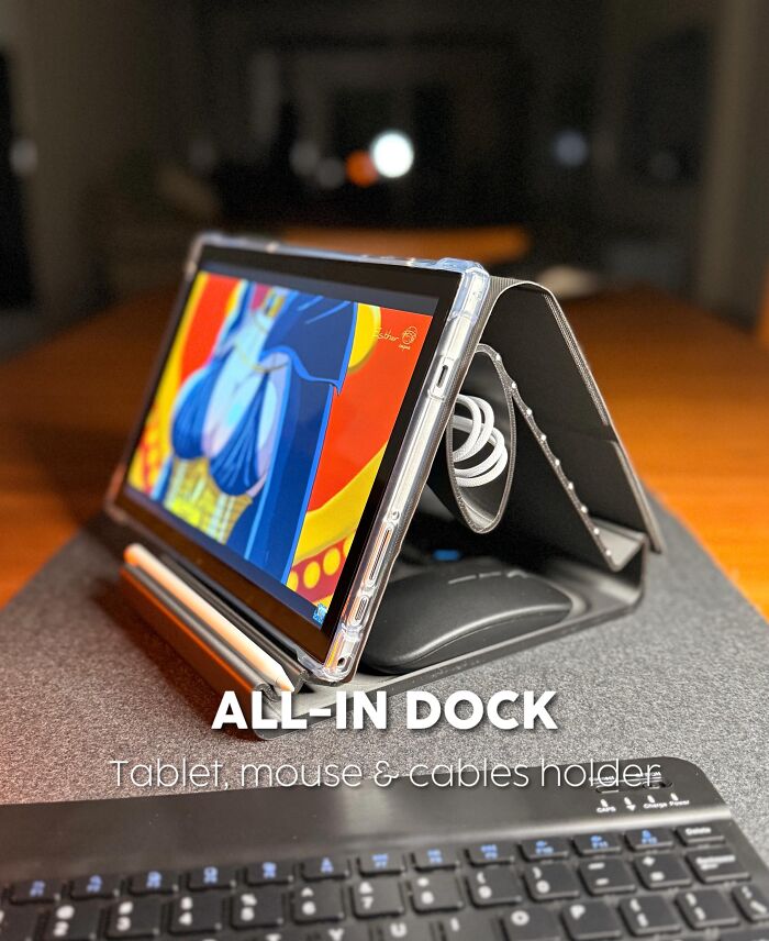 3D printed all-in dock holding tablet mouse and cables on a desk