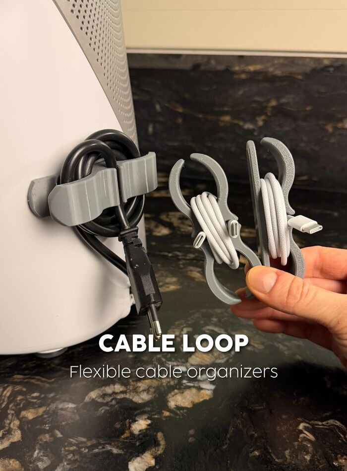 3D printed flexible cable organizers holding cables on kitchen counter