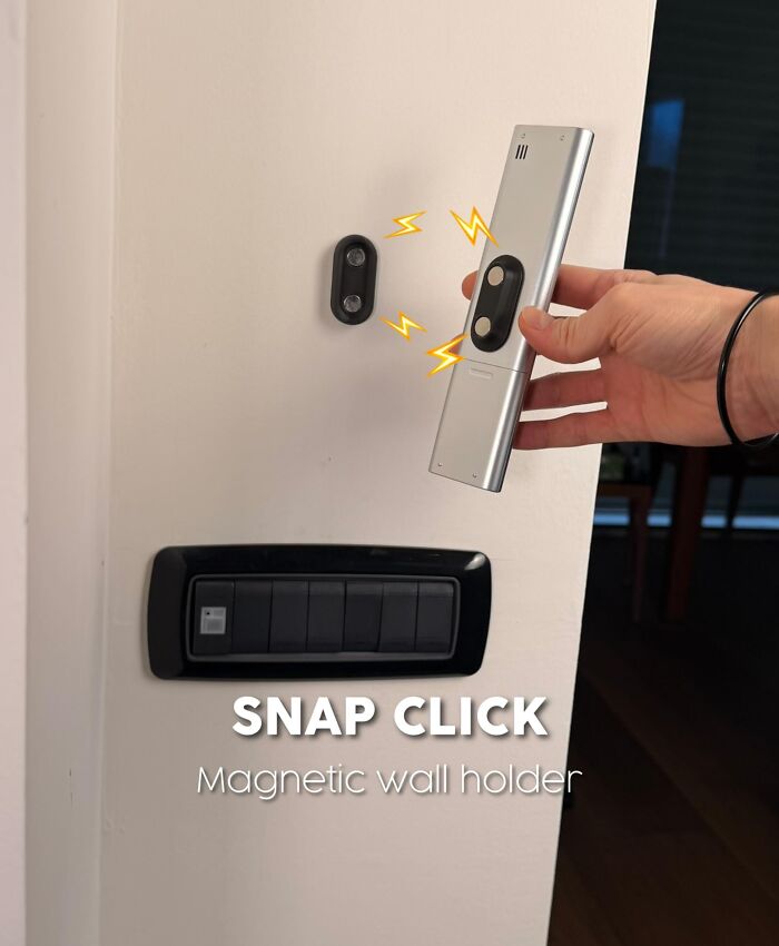 3D printed magnetic wall holder snapping a remote control on wall