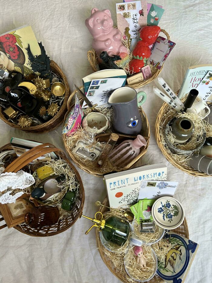Assorted gift baskets containing various unique thrift store finds