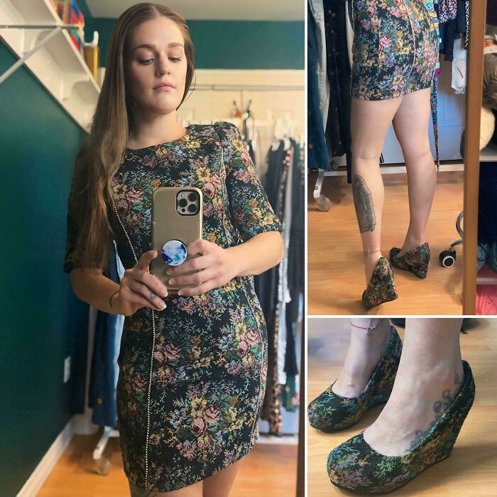 A woman wearing a matching floral dress and wedge shoes, styling her unique thrift store finds.