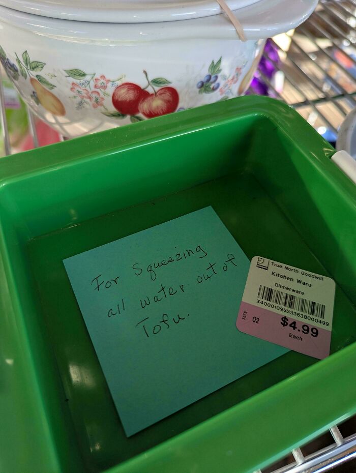 A green plastic tofu press, one of the unique thrift store finds with a handwritten note inside