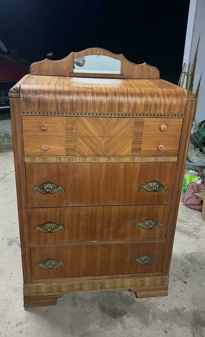 An art deco style wooden dresser, a unique thrift store find.
