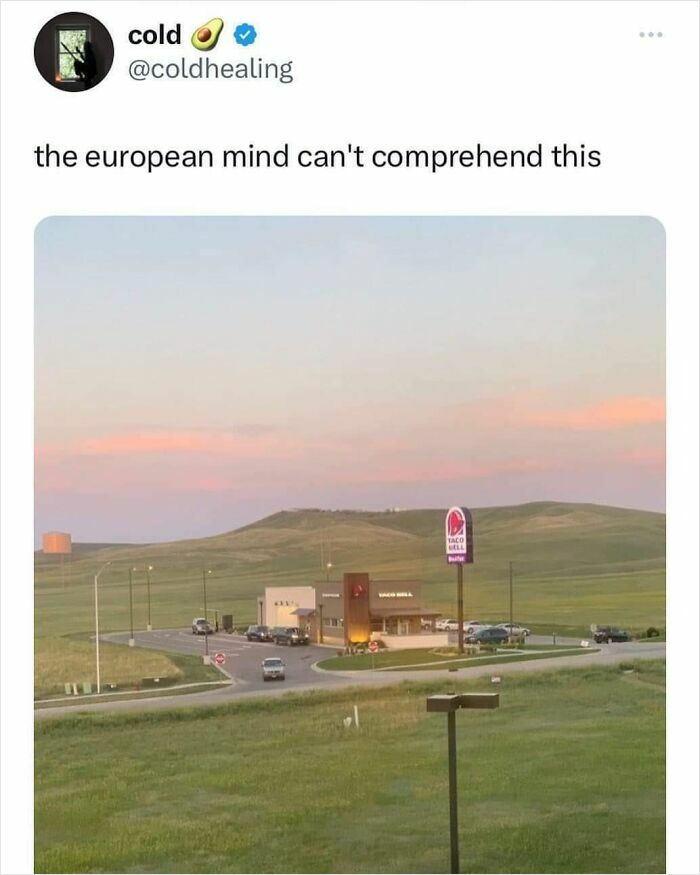 Taco Bell fast food restaurant in rural American landscape at sunset