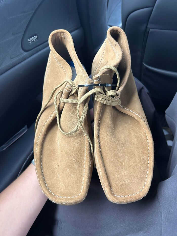 A pair of classic tan suede Wallabee shoes found among thrift store finds.