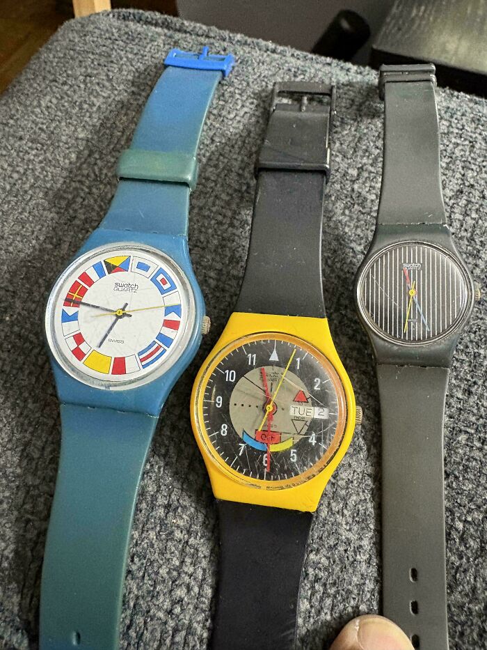 Three vintage Swatch watches found together as thrift store finds.