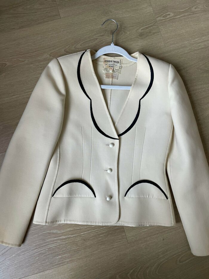 A chic Andre Laug cream-colored vintage blazer, showcasing high-quality thrift store finds