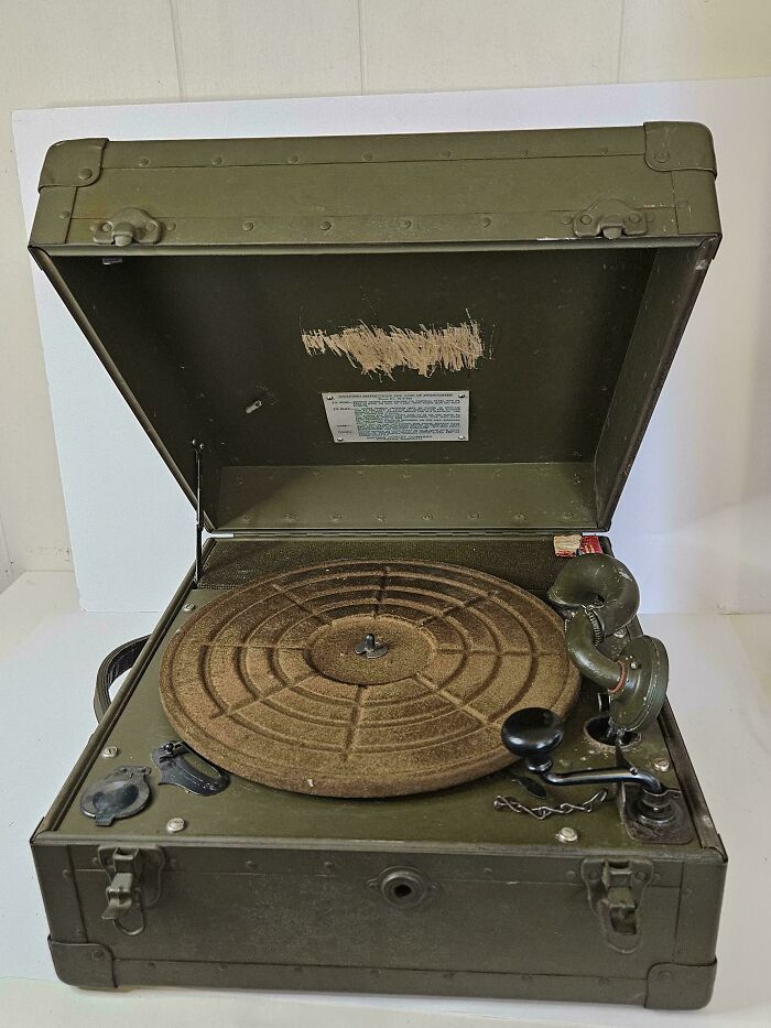 An old green military style portable record player, a rare antique thrift store find.