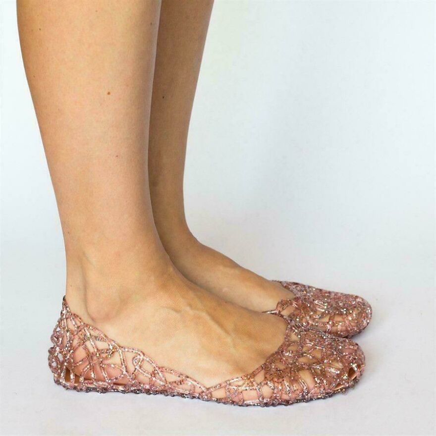A pair of sparkly pink plastic jelly shoes showcasing a classic early 2000s fashion trend.