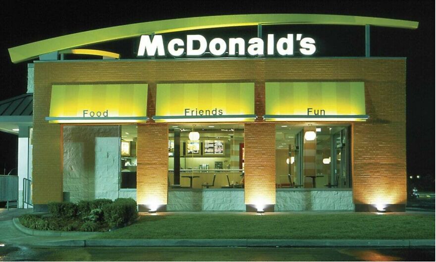 A classic, brightly lit McDonald's restaurant exterior from the early 2000s.