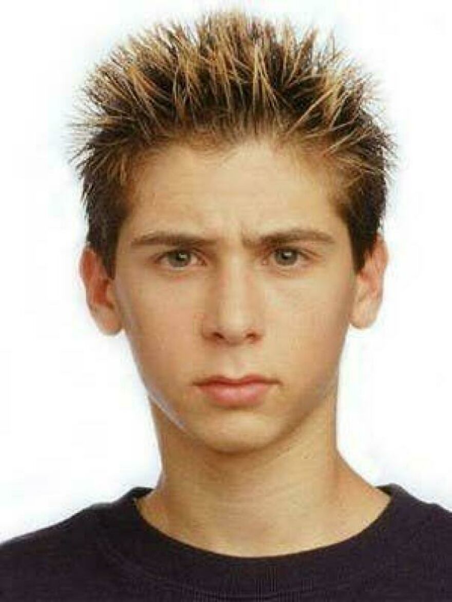 A teenage boy with a spiked haircut in the early 2000s, showcasing nostalgic hair trends.