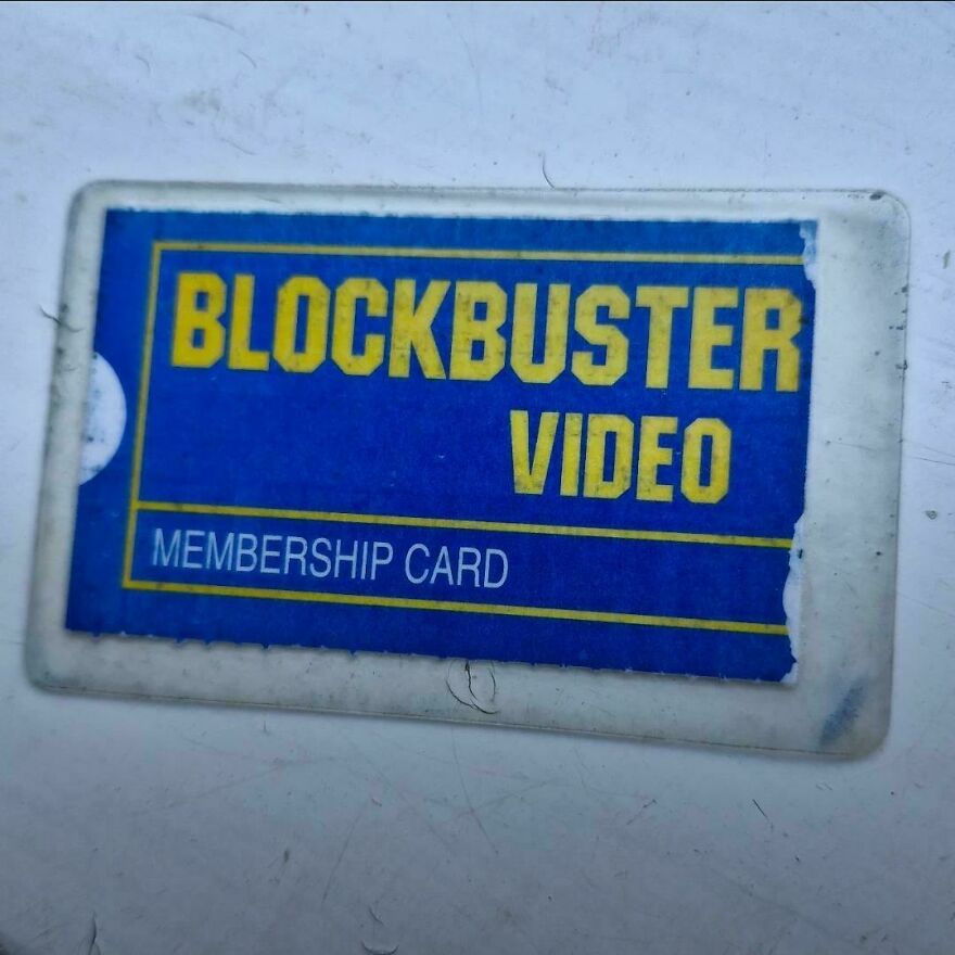 A blue Blockbuster Video membership card on a white surface, representing early 2000s nostalgia.
