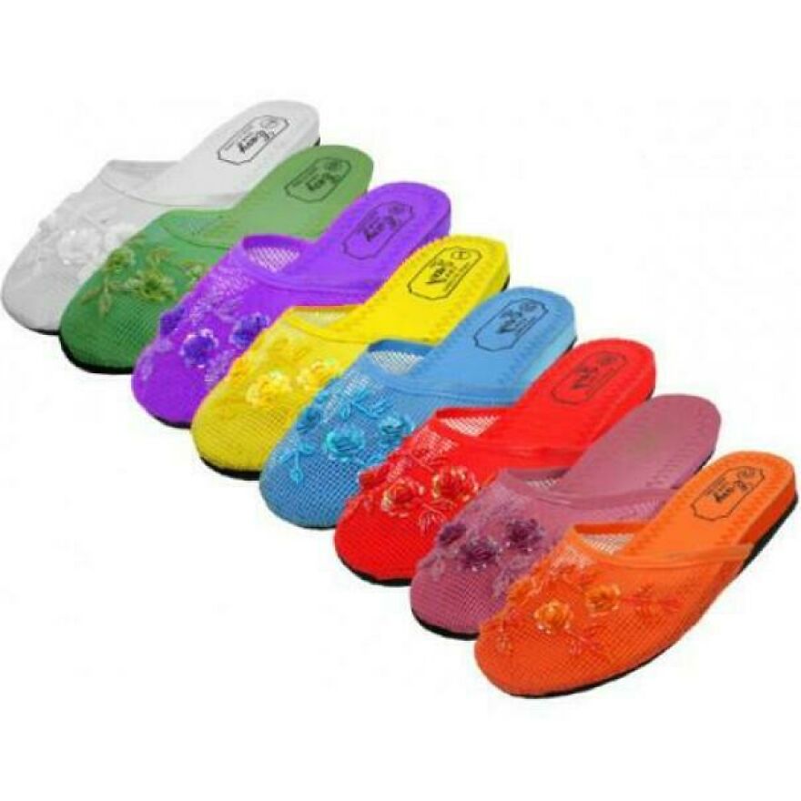 A row of colorful mesh Chinese slippers with floral embroidery, popular in the early 2000s.