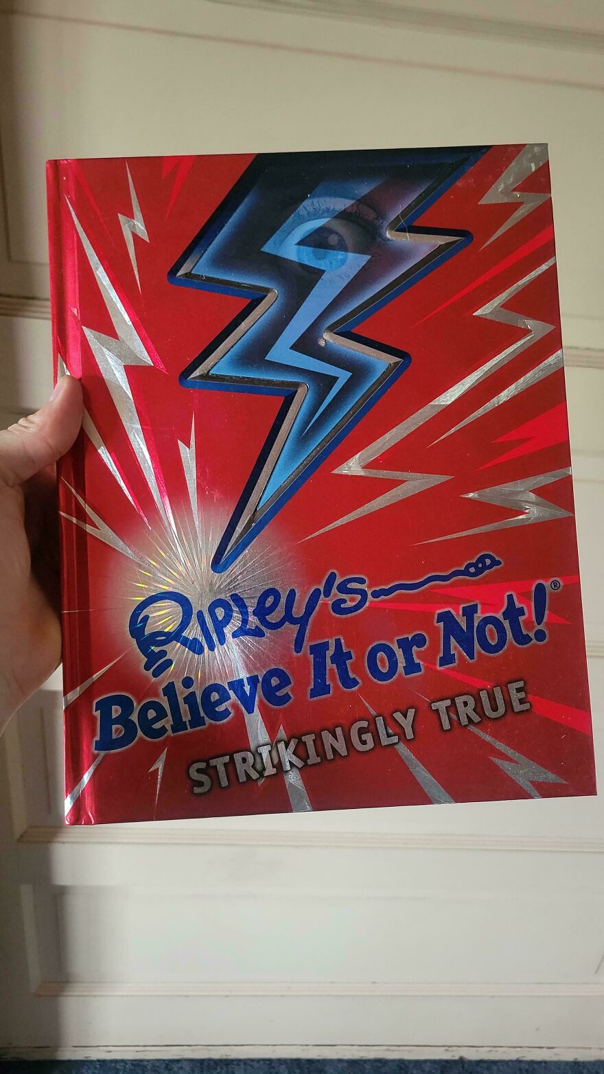 Nostalgic pics of a classic Ripley's Believe It or Not! book with a shiny red cover