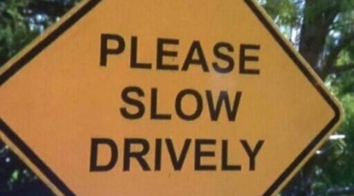 Funny job fail on road sign reading Please Slow Drively