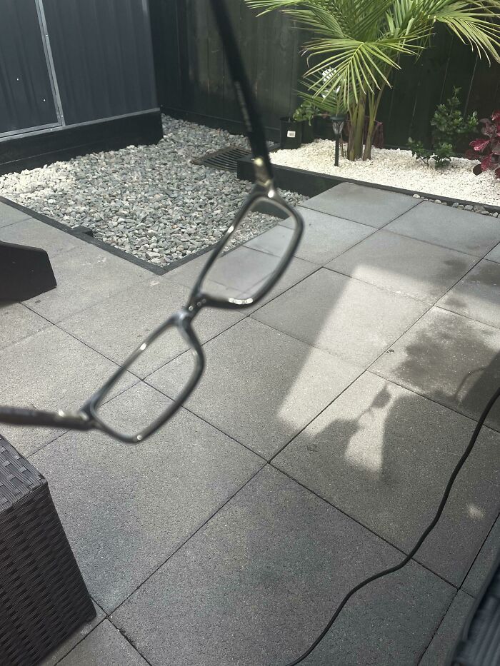Interesting and cool photos of glasses casting a shadow on a stone tiled patio