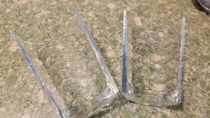 Two pieces of a cleanly broken glass illustrating interesting and cool photos of objects