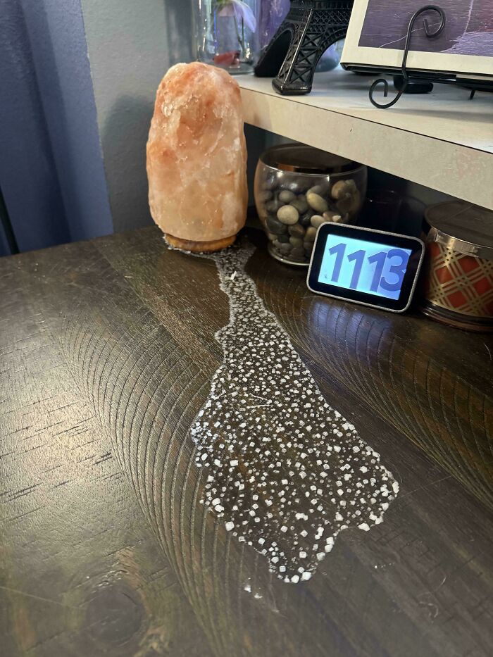 Interesting photo of a melting pink Himalayan salt lamp leaving a trail of salt crystals