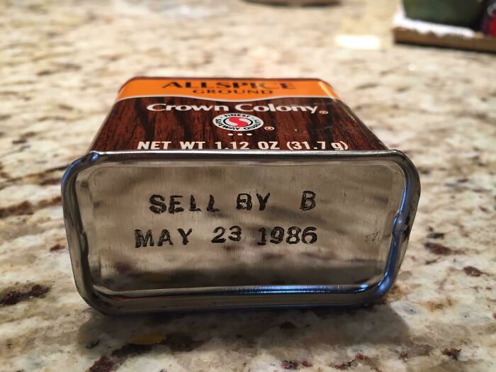 An old tin of Crown Colony ground allspice with a sell by date of May 23 1986, showing interesting photos of old spice.