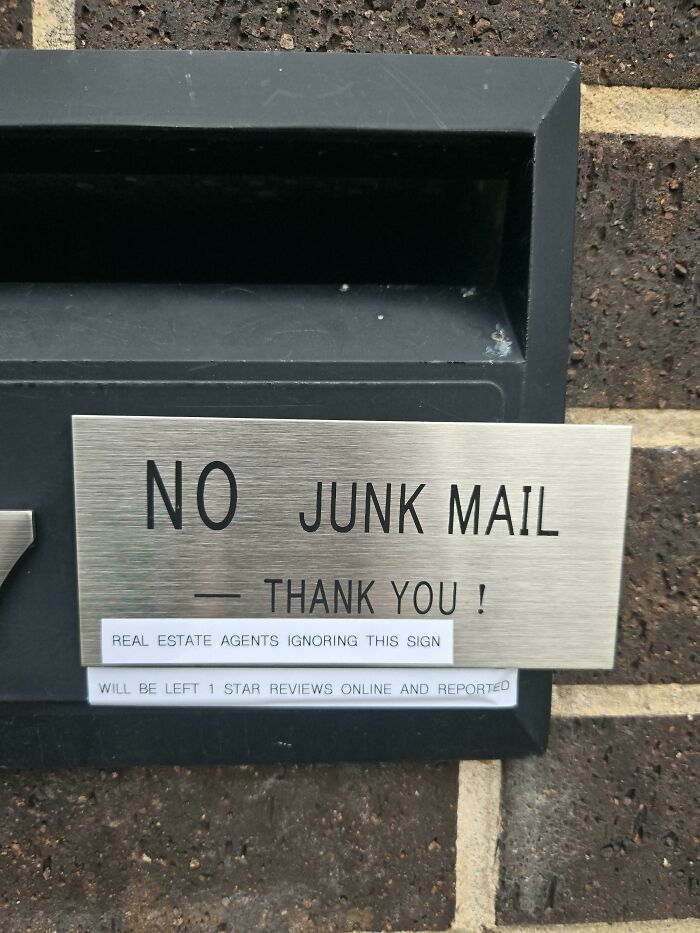 A mailbox sign warning real estate agents about unwanted junk mail