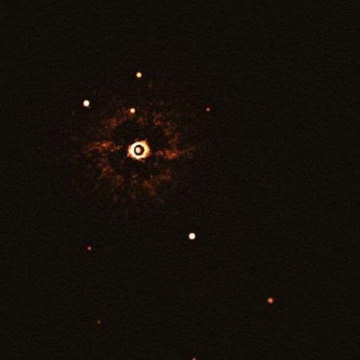 Interesting and cool photos showing a direct image of another solar system with a star and planets