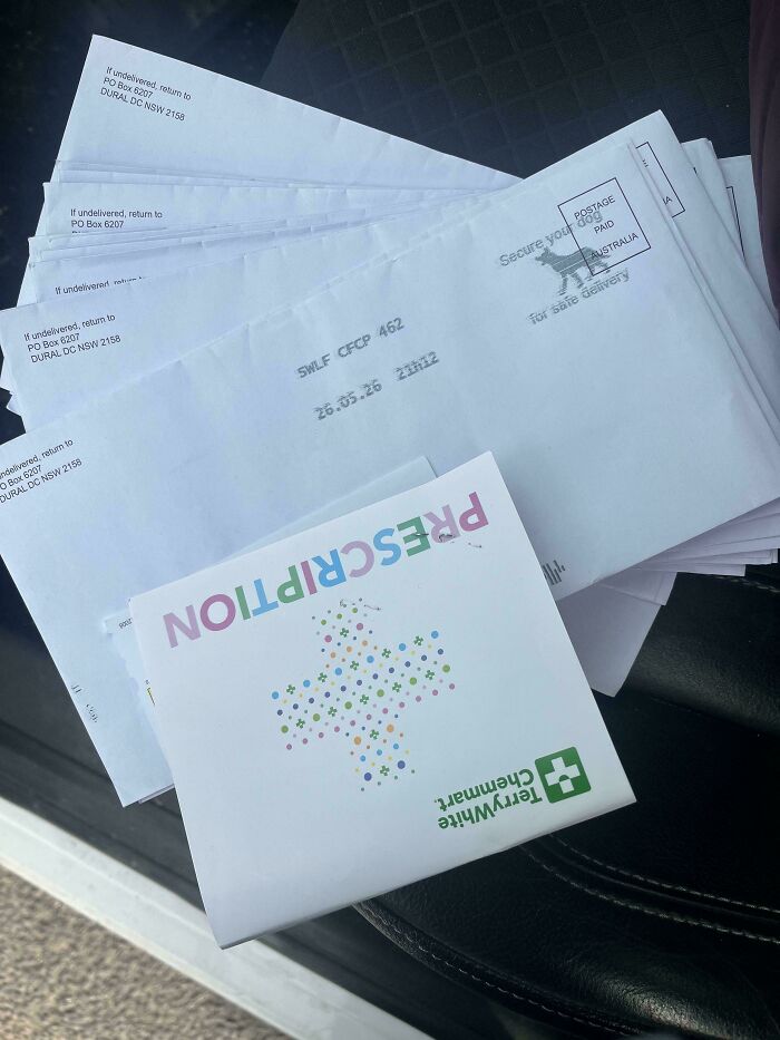 A stack of mail from a prescription pharmacy delivered to a rental address