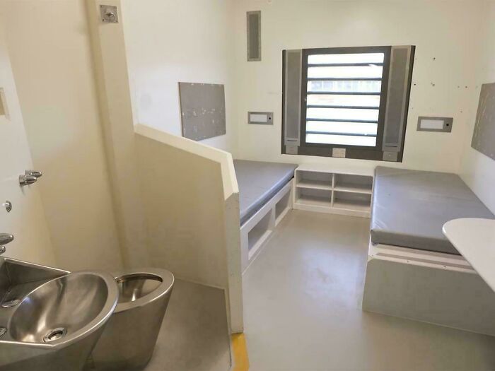 A disappointing renting and booking room that looks like a sterile prison cell with two simple single beds.