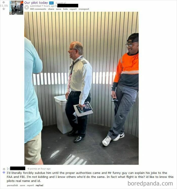 Pilot in uniform holding book standing near airplane door in tough guys post