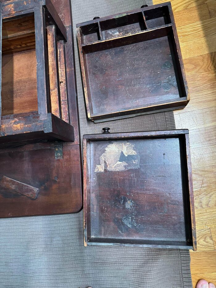 Top view of disassembled antique wooden drawers showcasing aged craftsmanship, a unique old treasure for antique lovers.