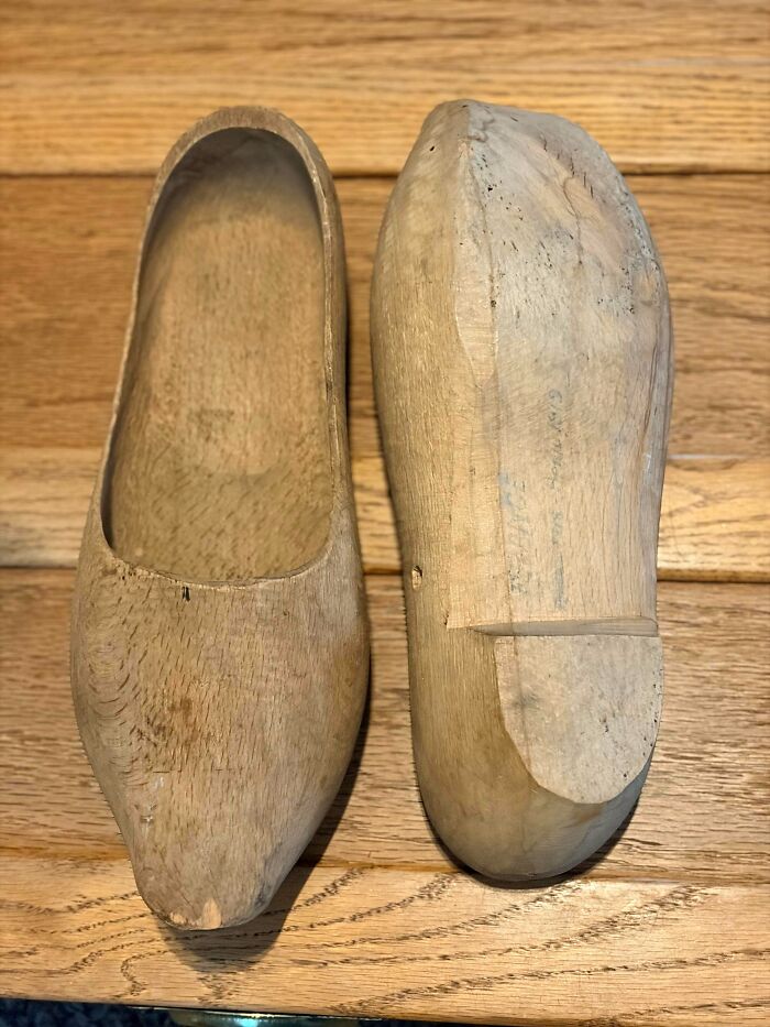 A pair of vintage carved wooden clogs, discovered among old treasures.
