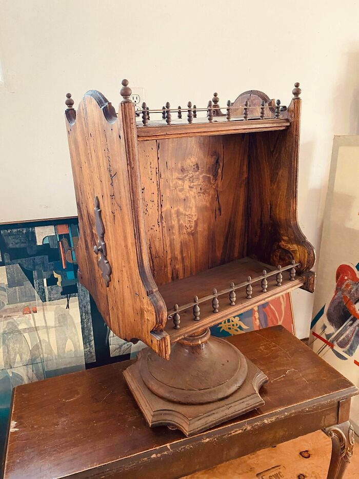 Ornate carved wooden rotating desktop shelf, one of many old treasures discovered by antique lovers.