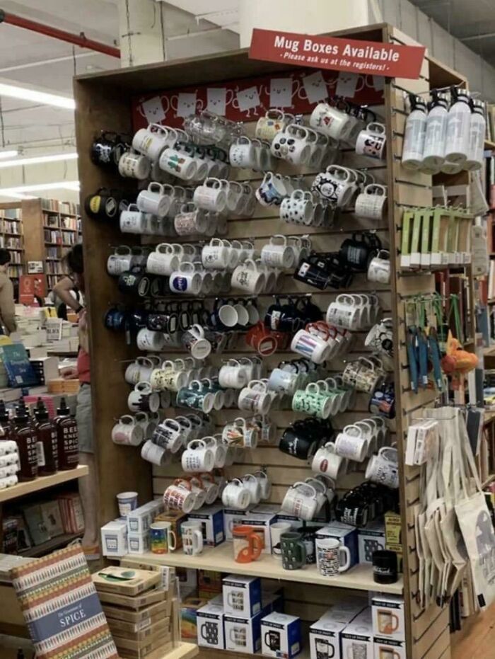Mugs hanging on shelves creating a confusing visual display in store