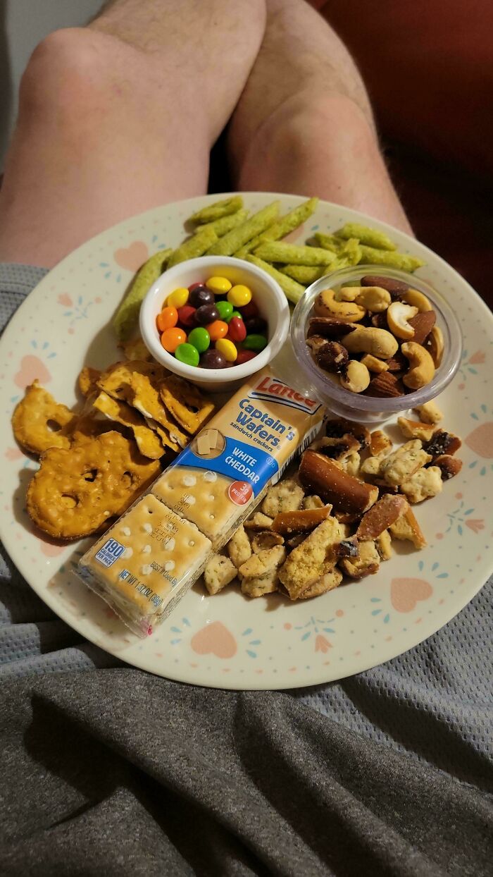 An assortment of snacks on a plate, representing the cute things wives prepare for their husbands.