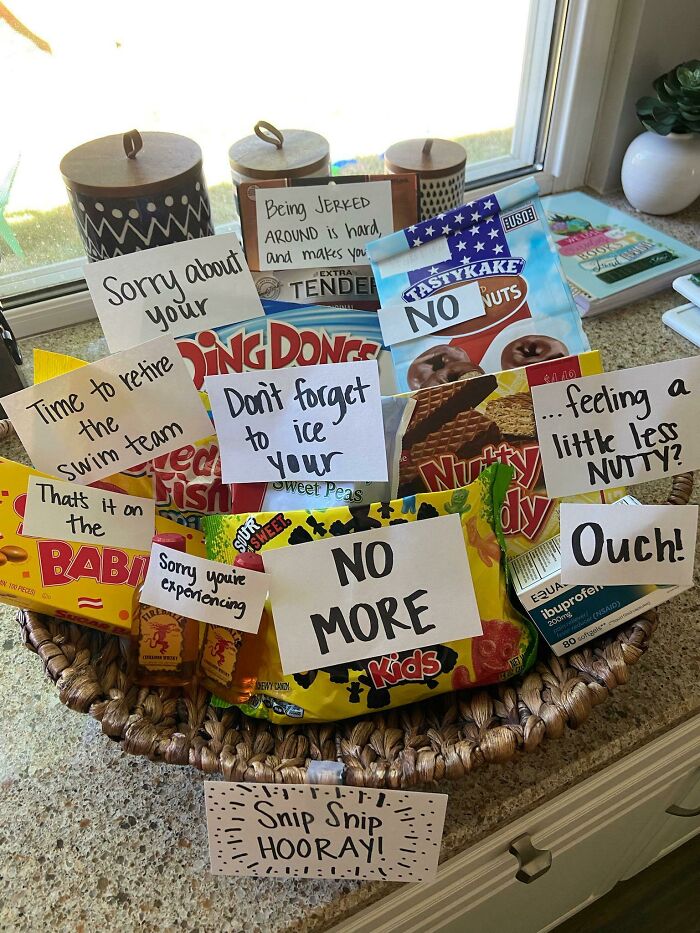 A humorous vasectomy care package filled with snacks and funny notes, showing things wives do
